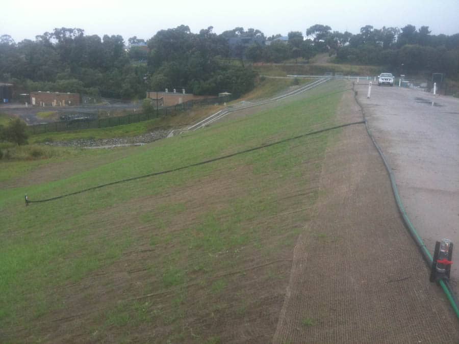 Grassy hill with road
