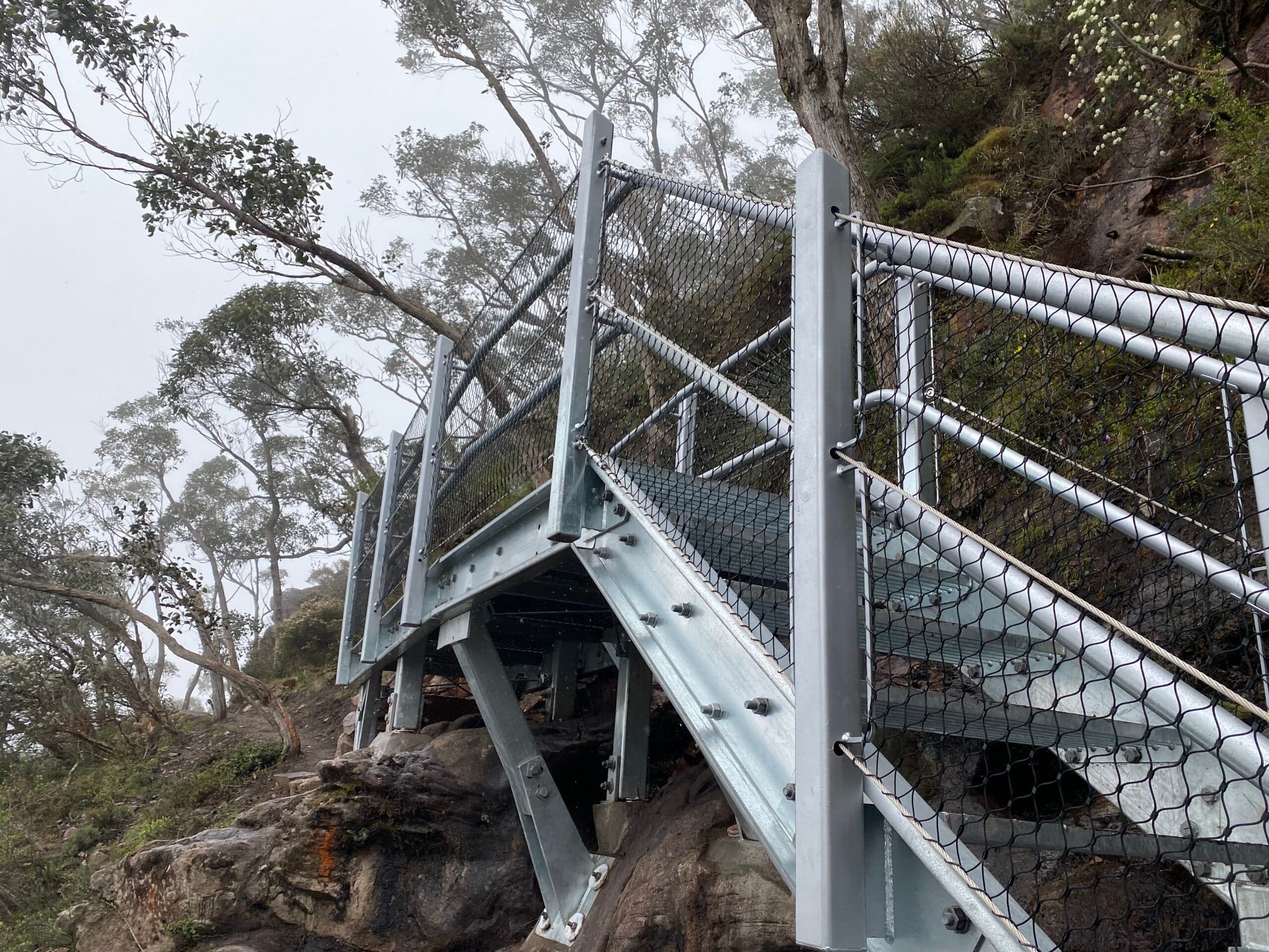 Metal stairs on cliff side
