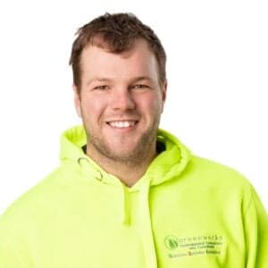 Man in green sweatshirt smiling