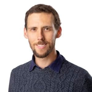 Man in sweater smiling