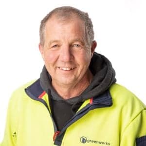 Man in workwear smiling