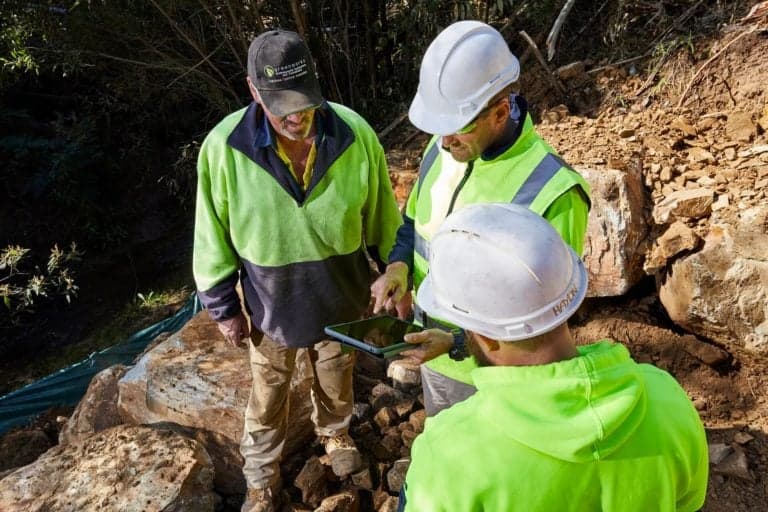 Construction workers using tablet