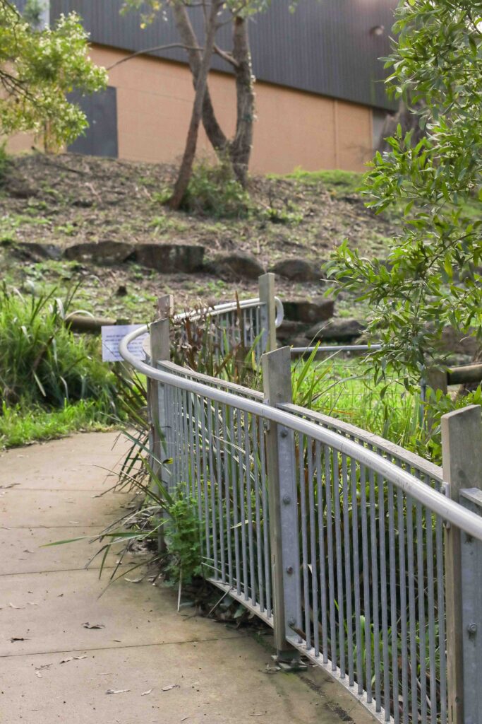 Curving path with metal railing