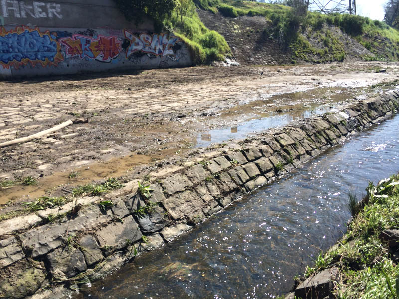 Waterway with stone embankment