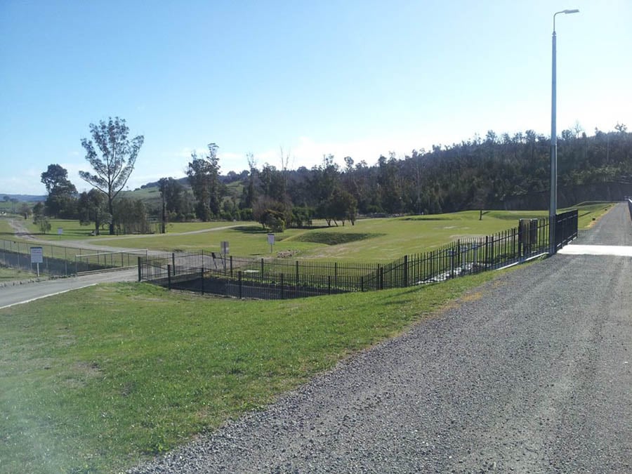 Parkland with fence and trees