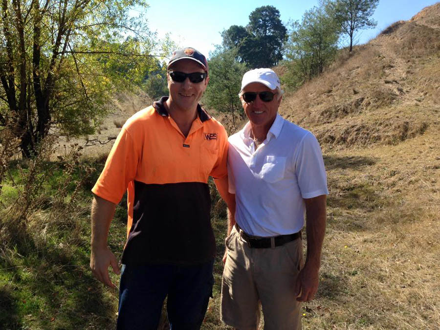 Two men outdoors smiling