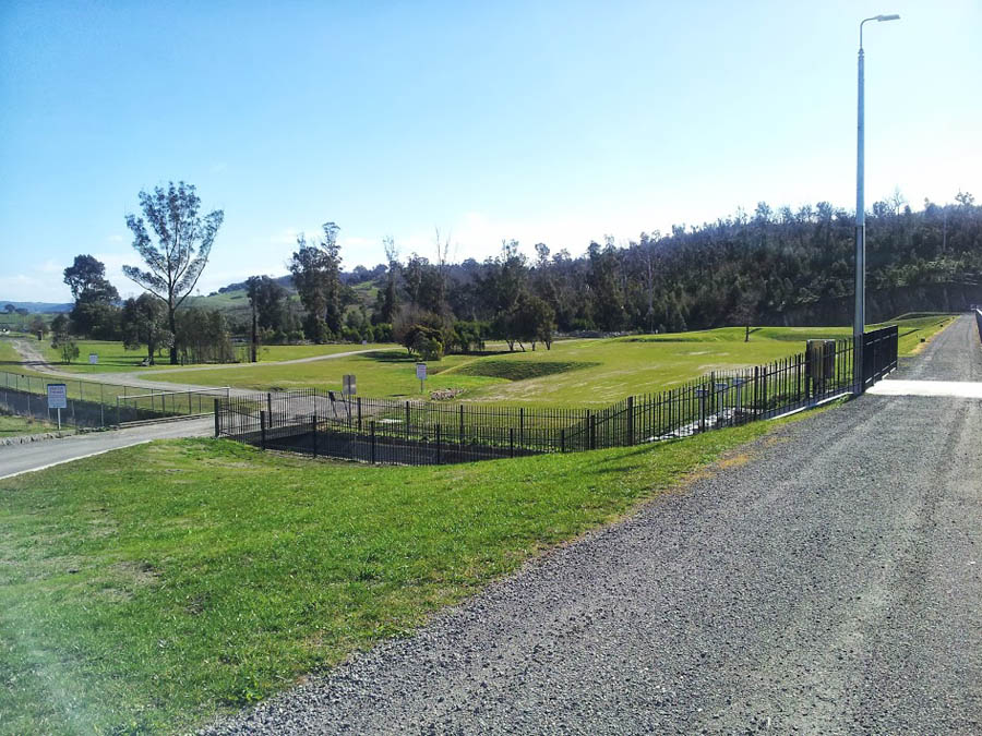 Green parkland with rolling hills