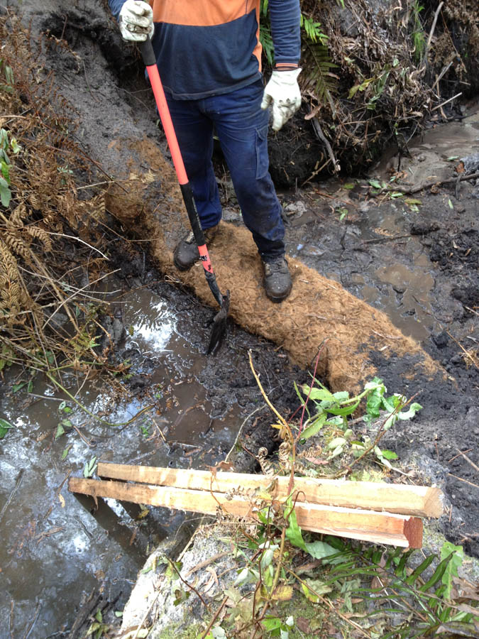 Worker digging with shovel
