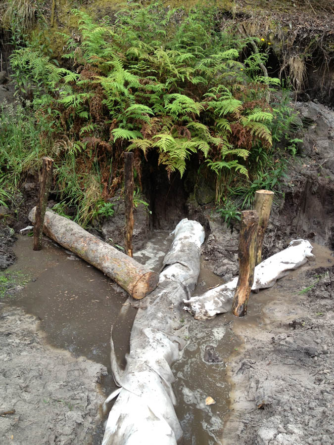 Water pipe installation with logs