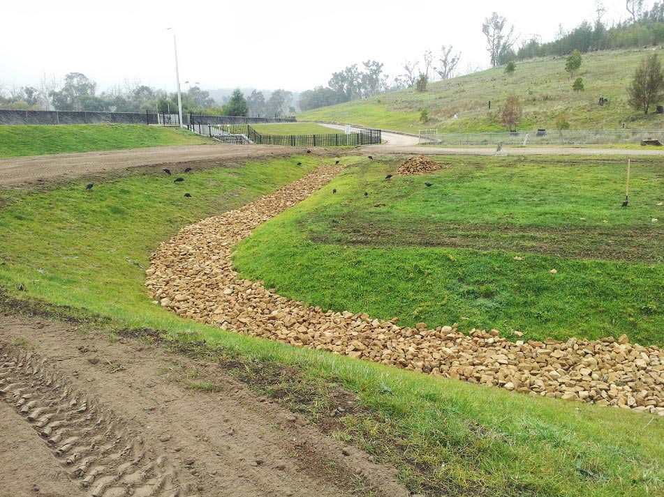 Grassed swale with rocks