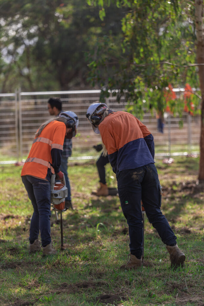 Construction workers planting outdoors