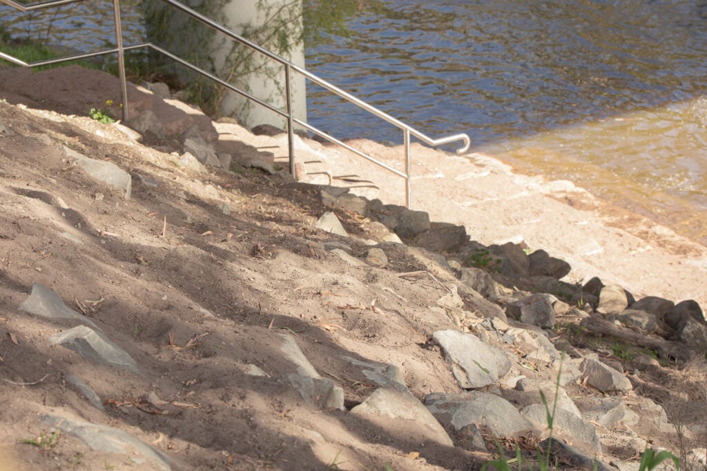 Riverbank with stairs and railing
