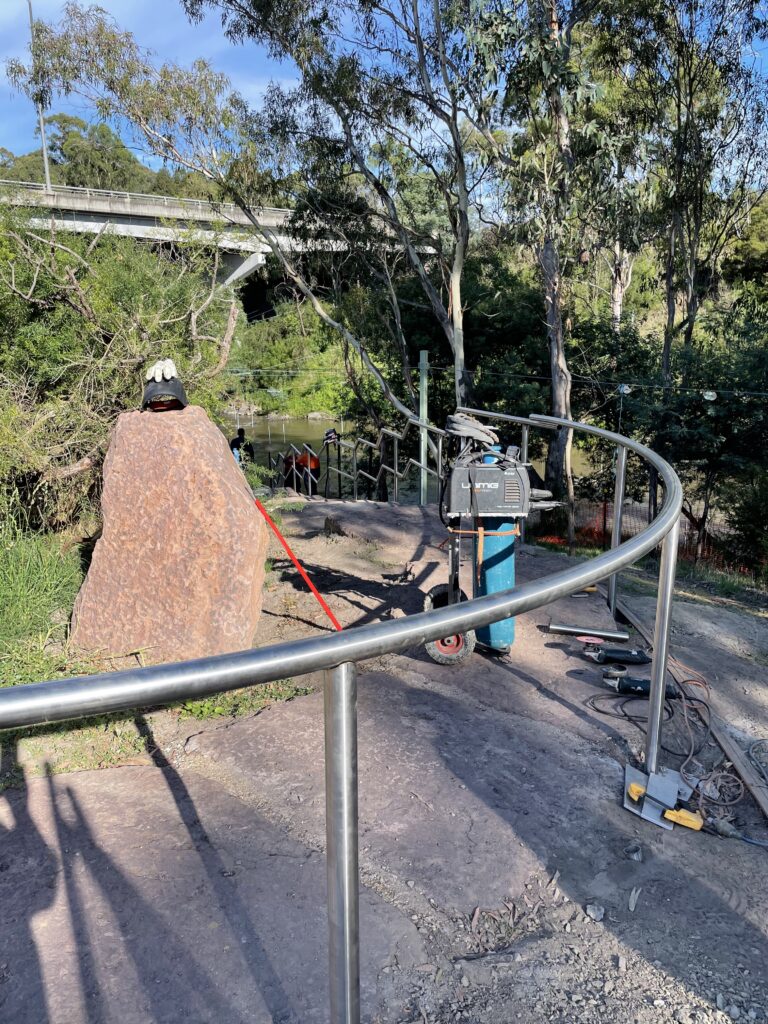 Curved metal railing outdoors
