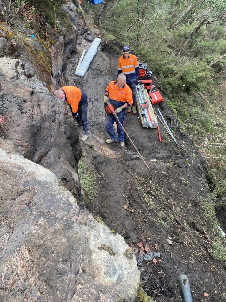 Rescue team on rocky slope