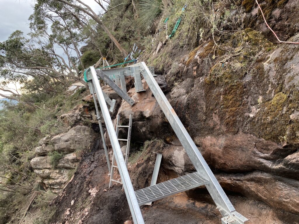 metal stairs on cliffside