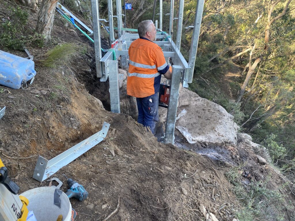 Construction worker on hillside