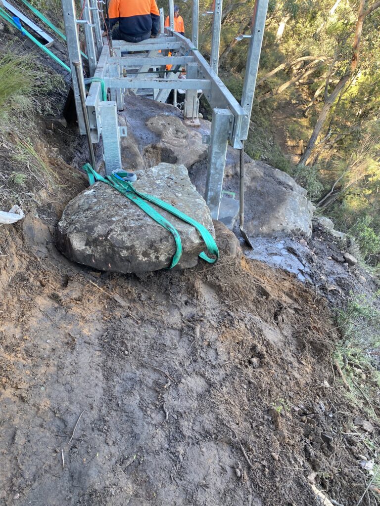 Lifting large stone with straps