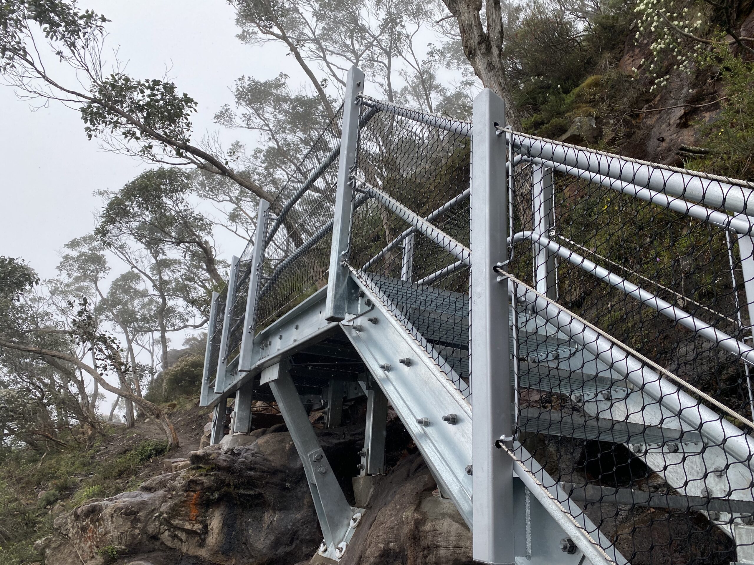 Metal stairs on cliff side