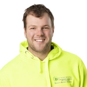 Man in green sweatshirt smiling