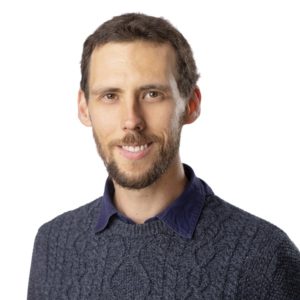Man in sweater smiling