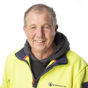 Man in workwear smiling